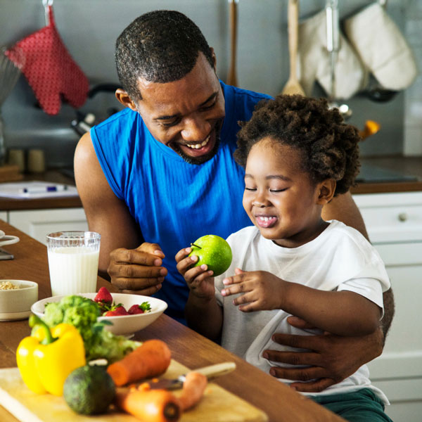 Preparing healthy snacks together can teach children the basics of good nutrition